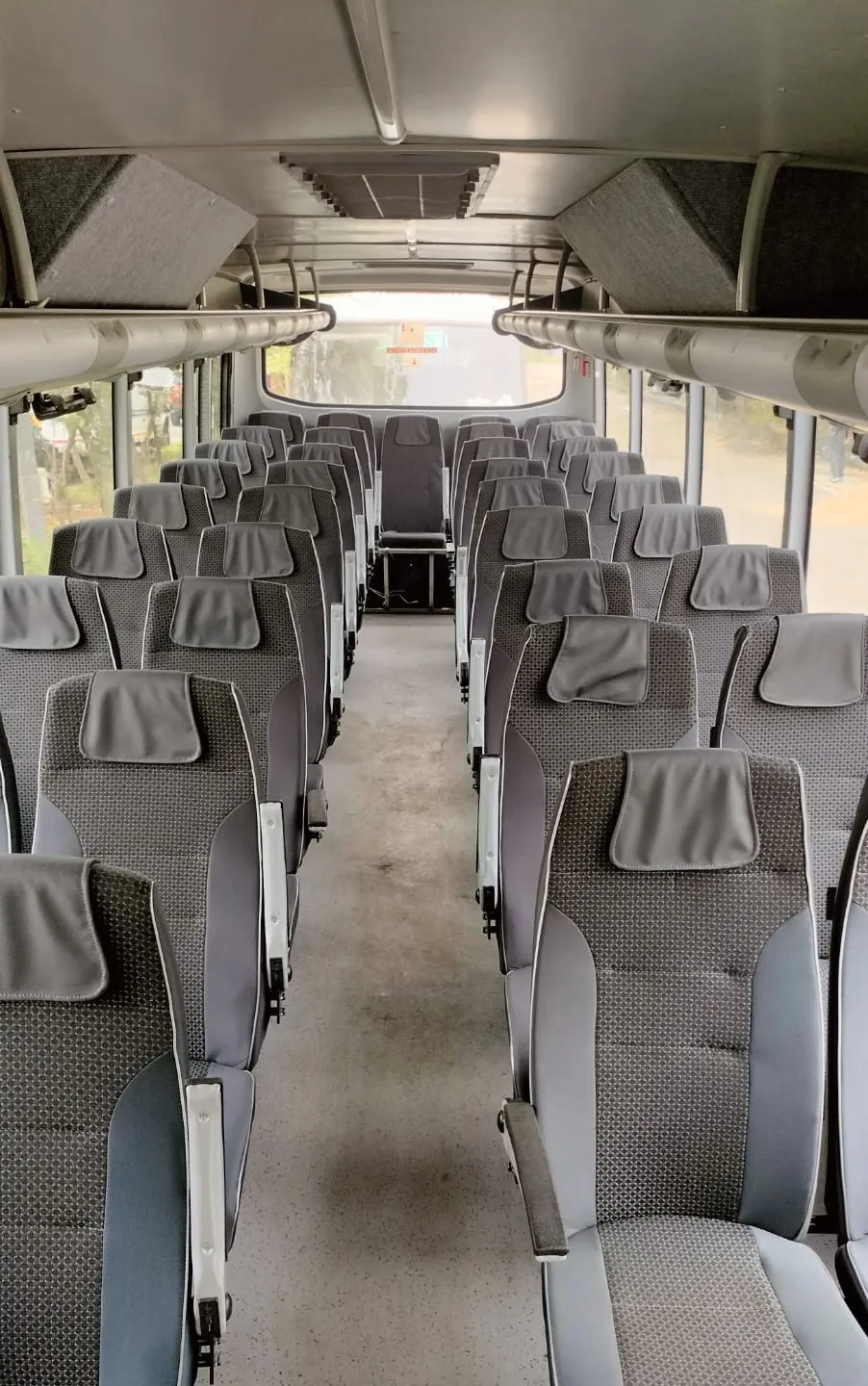 Mini bus interior with 2x2 pushback seats