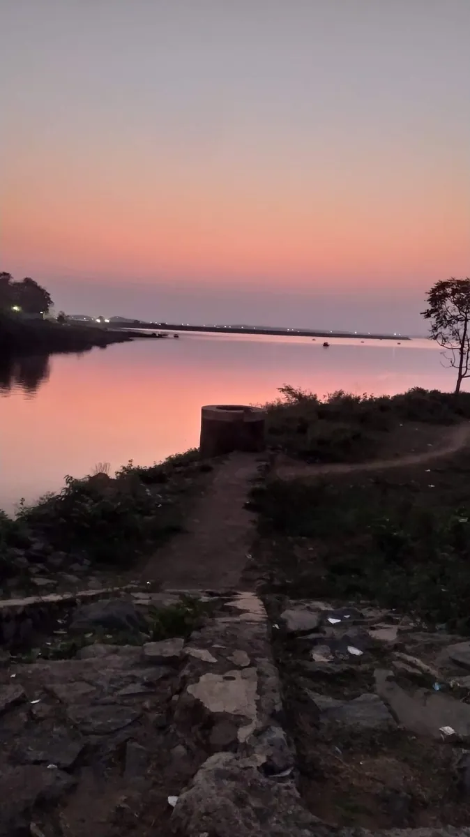 Dawn light over calm water